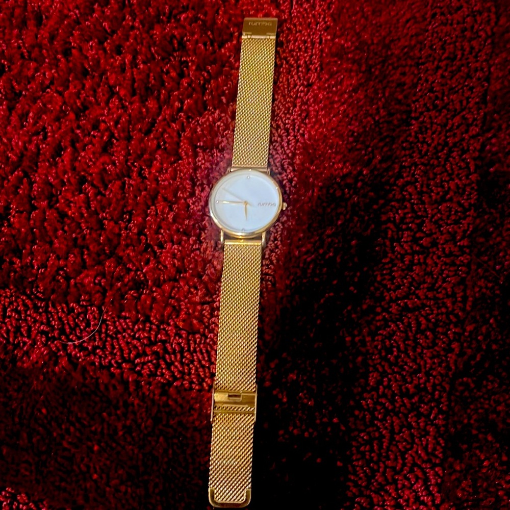 Gold tone watch with Diamond chips